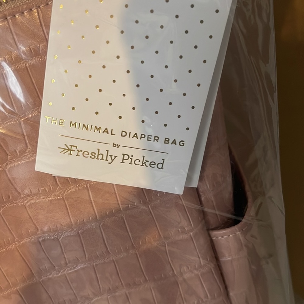Minimal Water Resistant Faux Leather Diaper Backpack
FRESHLY PICKED - Picture 8 of 9